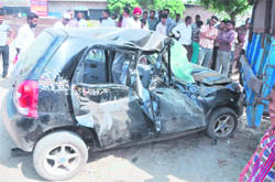 The mangled remains of the car that hit a trailer killing three youths on Humbran road in Ludhiana.