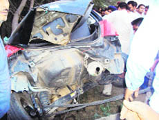 The badly damaged Maruti Swift that rammed into a tree killing a youth near Jagraon on Sunday evening.