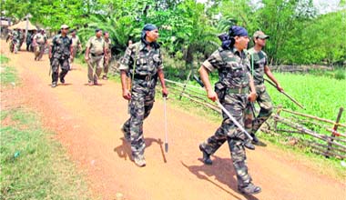RAF personnel patrol a street in Beluti village following a clash between CPM and Trinamool Congress activists in Birbhum district of West Bengal on Monday