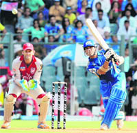 Mumbai Indians Sachin Tendulkar plays a shot against Kings XI Punjab during their match at the Wankhede Stadium in Mumbai on Monday. Mumbai Indians won the match by 23 runs.