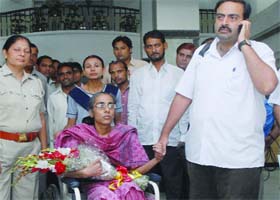 Vipin Behl takes his sister Sonali home after she was discharged from a hospital in Noida on Tuesday
