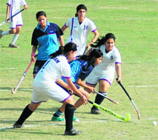 A match in the Dehradun District Council Schools Association Inter-school Girls Hockey Tournament in Dehradun on Tuesday.