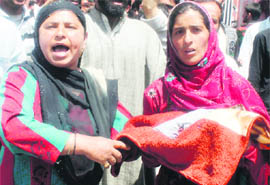 Relatives of a woman from Kupwara protest against the management of the Lalded maternity hospital in Srinagar on Tuesday.