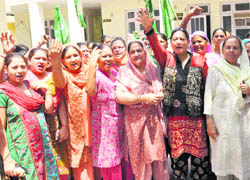 Activists of the Mahila Wing of the PDP stage a protest in the Gandhi Nagar area of Jammu