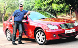 WEELL-WHEELED: (Top) Ankush stands beside his red Merc