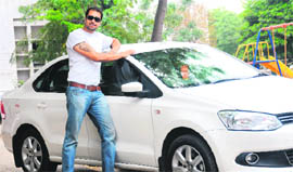 (below) Karan flaunts his chrome alloys