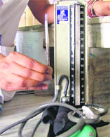 A mercury-based thermometer and BP apparatus being used at a hospital in Ludhiana.