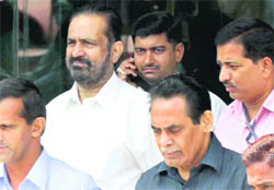 Former Chairman of the CWG Organising Committee Suresh Kalmadi leaves the CBI headquarters for the Patiala House court, in New Delhi on Wednesday. 