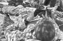 A US soldier plays a game on his portable playstation at Meis base in Marjah (Afghanistan)