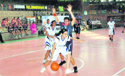 Players in action in a match in the Welham Girls School Jubilee All-India Basketball Tournament in Dehradun on Thursday.