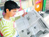 A youth in Srinagar on Thursday updates himself about the US operation in Pakistan against Osama bin Laden.