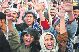 Students from a madrassa shout anti-US slogans to protest against the killing of Osama bin Laden in Quetta 
