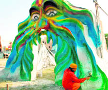A worker gives final touches to a replica of the cave of Shri Amarnath temple ahead of a religious function being organised by Shiv Parvati Sewa Dal, Chandigarh, at Dasehra ground, Phase VIII, Mohali, on Friday