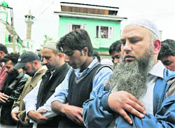 People offer funeral prayers in absentia for Al-Qaida chief Osama bin Laden in Srinagar on Friday
