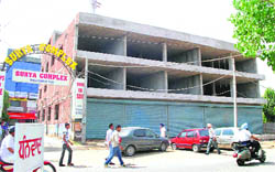 New shopping plaza under construction on Leela Bhawan Road 
