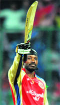 Royal Challengers Chris Gayle celebrates his century against Kings XI Punjab in Bangalore on Friday
