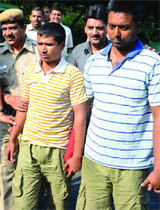 Two accused involved in a robbery-cum-murder case in New Delhi on Saturday. 