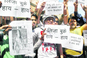 Activists of the Kranti Dal hold a protest in Jammu on Saturday against Australian model Lisa Burke for sporting pictures of Hindu deities on her objectionable outfits during a recently held fashion show.
