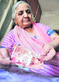 Krishna Monga shows a picture of her daughter’s marriage