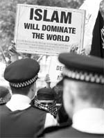Police stands guard as a pro-Osama bin Laden protest takes place outside the US Embassy in London.  AP/PTI