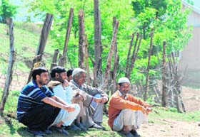 Villagers outside a polling station after casting their vote in Nowgam area of Shangus block on Sunday
