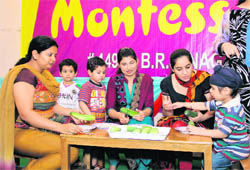 Tiny tots and their mothers participate in fun activities at ABC Montessori to mark Mothers Day in Ludhiana. A Tribune photograph