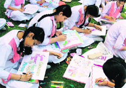 Students make posters at GMT Public School to mark Mothers Day in Ludhiana. Photo: Inderjeet Verma
