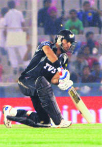 Pune Warriors Yuvraj Singh hits one to the fence during their match against the Kings XI Punjab in Mohali on Sunday. 