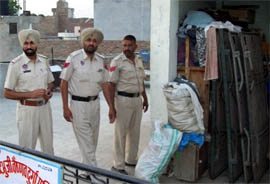 Cops conducting a search to recover fake arms licences in Abohar late on Sunday evening.