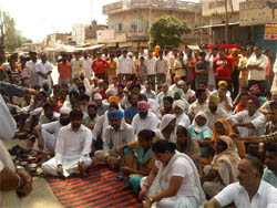 Residents of Mallanwala in Ferozepur district squat in front of the police station to lodge their protest against police inaction in a case related to dowry, on Monday.  The protesters gheraoed the police station and also blocked the Ferozepur-Makhu road blaming the police for playing a partisan role in the case.