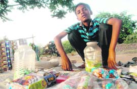 In violation of the tobacco Act, a boy sells gutka, cigarettes etc on a roadside at Sector 44 in Chandigarh.