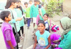 Students of BE I (second semester), PEC University of Technology, interact with slum kids and women during an awareness campaign