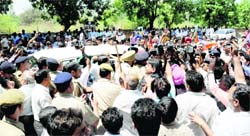 BJP activists block the road in front of the CBI office at Sector 30, Chandigarh,
