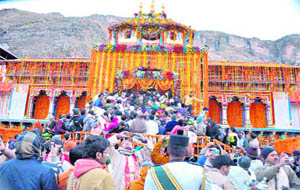 Devotees queue up at the shrine of Badrinath, the portals of which were opened to pilgrims on Monday