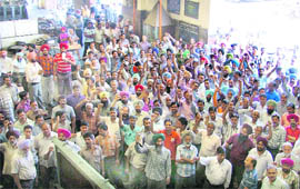 Railway employees protest against frequent snatching incidents at the railway diesel shed in Ludhiana on Monday.
