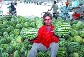 A vendor selling watermelons in Bathinda on a hot Tuesday afternoon