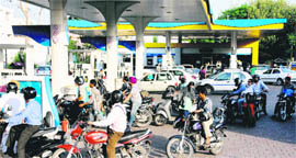 Though there was no hike in fuel prices, long queues of vehicles were witnessed at petrol stations in Chandigarh on Tuesday. Tribune photo: Manoj Mahajan