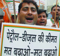 BJP activists shout slogans against a proposed hike in the prices of petrol, diesel and LPG in New Delhi 