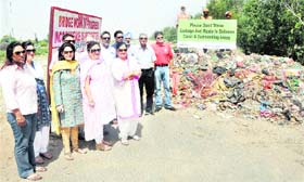 Members of the Let's Clean Ludhiana Foundation urge residents not to throw garbage into Sidhwan Canal