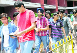 Students come out of an examination centre after taking AIEEE on Wednesday