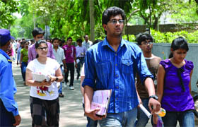 Students come out after reappearing for the AIEEE examination after it was once postponed due to paper leak, in New Delhi on Wednesday. @