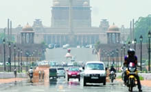 Mirage appears on Rajpath as the temperature rises in New Delhi on Wednesday. 