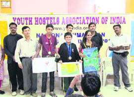 Participants of a trekking expedition display their paintings at Dalhousie on Wednesday.