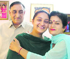 An elated Shruti Sharma (centre) with her parents after the declaration of the All India Civil Services examination results