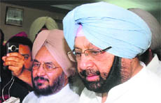 Capt Amarinder Singh (right) and Lal Singh during a meeting with party workers in Jalandhar