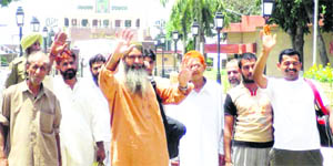 Elated Pakistani prisoners at the Indo-Pak Attari border. Eight Pakistanis were released under the prisoner exchange programme between India and Pakistan after completion of their jail terms.