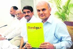 Adviser to the UT Administrator KK Sharma releases the book ‘Suvidha’ in Chandigarh on Thursday