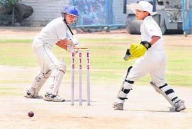 A batsman watches the ball after hitting a shot during a match at Sector 48, Chandigarh, on Thursday