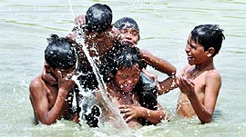 Children play in the Yamuna on a hot Thursday afternoon in New Delhi.