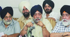 DSGMC president Paramjeet SIngh Sarana (C) addresses a press conference in New Delhi on Thursday.